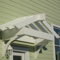 Decorative over the door pergola with CNC braces for support