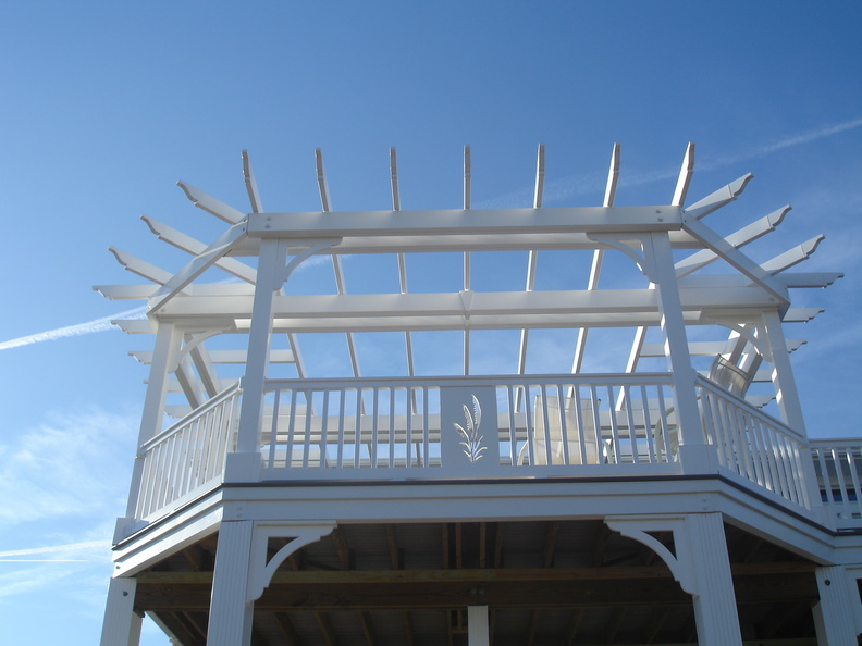 Custom pergola T-Rail with sea oat insert and custom CNC braces