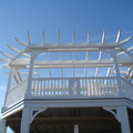 Custom pergola T-Rail with sea oat insert and custom CNC braces